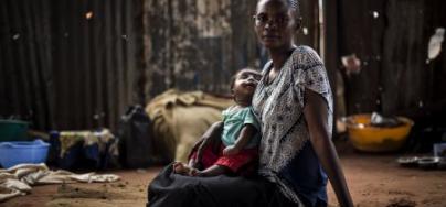 Berte sits with her child inside a church which is a refuge for Internally Displaced Persons (IDPs) affected by the ongoing conflict in the Kasai Province. Photo: John Wessels/Oxfam