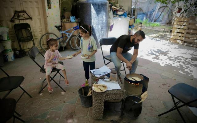 Raed Mansour is challenged to make food for his three children who lost significant weight during the Israel's war on Gaza.