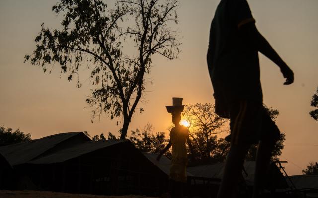 Refugees returning home at night in Jewi South Sudanese refugee camp in Gambella.