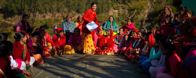 Pramila Bhul speaking to members of a Women’s Cooperative during its annual meeting.