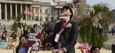 In the wake of the Panama Papers scandal in 2016, tax campaigners turned London's Trafalgar Square into a tropical tax haven, putting pressure on world leaders to take action on tax dodging. Photo: Andy Hall/Oxfam