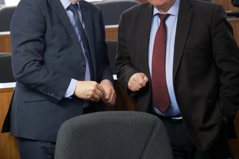 Informal negotiations between two politicians (image courtesy Deposit Photos)